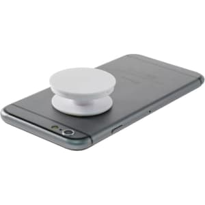 A white pocket socket phone stand rests on the back of a dark grey smartphone, featuring a minimalist design.