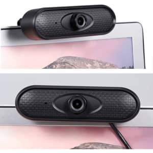 A black webcam camera mounted on the top of a computer monitor, featuring a textured surface and lens.