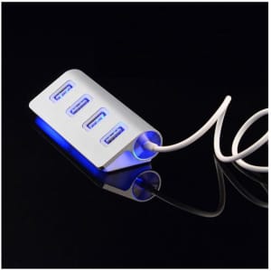 A silver USB hub with four ports and blue LED lighting, featuring a white cable. Includes a branding logo.