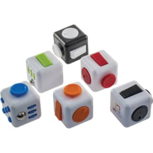 A collection of six fidget cubes in white, black, and various bright colours, featuring different tactile buttons and switches.