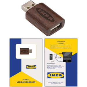 A bamboo USB data blocker with a wooden finish, accompanied by packaging featuring a logo and vibrant colours.