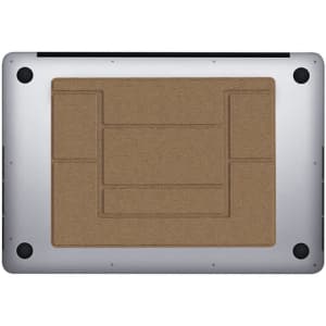 A silver laptop stand with a textured brown surface on top, featuring various cutouts for ventilation.