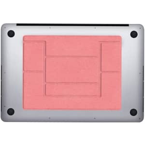 A slim laptop stand in coral pink with a textured surface and black accents. Features a logo on the base.