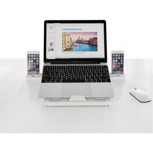 A foldable laptop stand in white, supporting a laptop and two smartphones, featuring a sleek design.