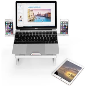 A foldable laptop stand in silver, featuring two phone holders and a tablet, with a laptop displaying vibrant imagery.