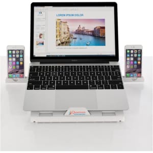 A foldable laptop stand in white, supporting a laptop and two smartphones. The setup includes a subtle logo on the stand.