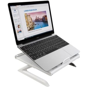 A white foldable laptop stand with a laptop displaying a presentation on it. The stand has an adjustable height design.