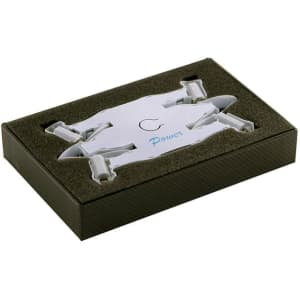 A foldable white drone in a padded black box, featuring a logo and sleek design.