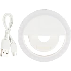 A white circular LED selfie light with a USB charging cable. The light features a ring design for illumination.