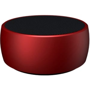 A round red wireless speaker with a black mesh top and a smooth finish, featuring a logo on the side.