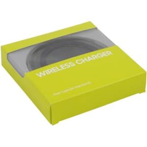 A green packaging box containing a circular wireless charger, featuring a transparent window and a logo.