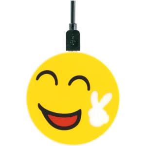 A yellow wireless charger featuring a smiling emoji design with a peace sign. It has a black charging cable attached.