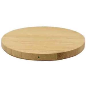 A round bamboo fast charger in a natural wood finish, featuring a sleek, minimalist design and a small logo.