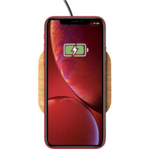 A wireless bamboo fast charger with a red smartphone displaying a charging symbol. The charger has a natural wood finish.
