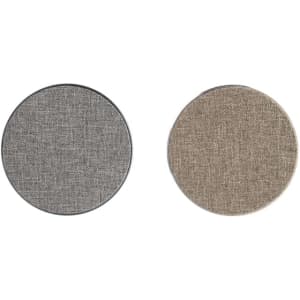 Round wireless chargers in grey and beige tweed fabric with a metallic edge. Each has a branding logo.