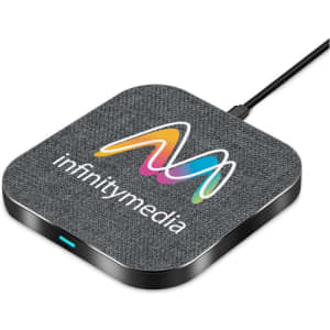 A square wireless charger in grey fabric with a black base, featuring a logo on the surface.
