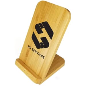 A bamboo wireless charger with a slanted design, featuring branding on the front.