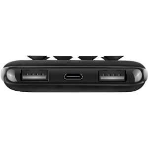 A black power bank with multiple USB ports and a micro USB input, featuring a logo on its surface.