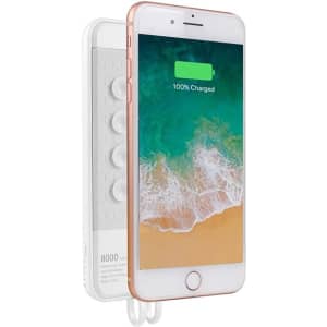 A white wireless power bank with a rose gold edge, featuring a digital screen showing a fully charged phone.