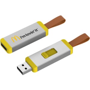 A silver and yellow Hexham Flash Drive with a brown strap, featuring a logo on one side.