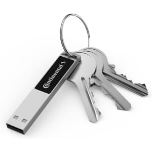 A silver LED flash drive attached to a keyring with several metal keys. The drive has a logo on its side.