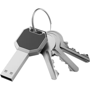 A silver and black USB flash drive attached to a keyring, alongside several metallic keys.