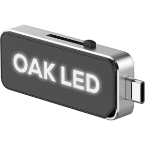 A sleek silver and black USB flash drive with a Type-C connector and a visible logo.