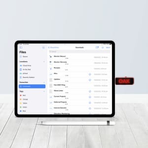 An Oak Type-C LED Flash Drive connected to a tablet, displaying file icons on a light background.