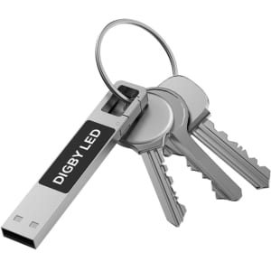 A silver LED flash drive attached to a keyring with several metal keys. The drive has a branding logo.