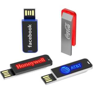 A collection of four USB flash drives in various colours, featuring logos from Facebook, Honeywell, AT&T, and Coca-Cola.