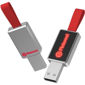 A silver USB flash drive with a red strap and a logo on one side.
