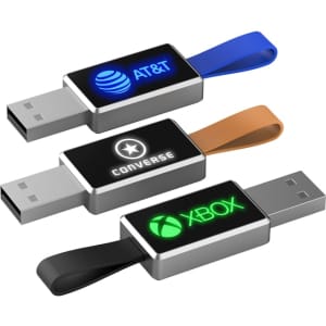Three LED flash drives in black, orange, and blue, featuring different logos and a strap for easy handling.