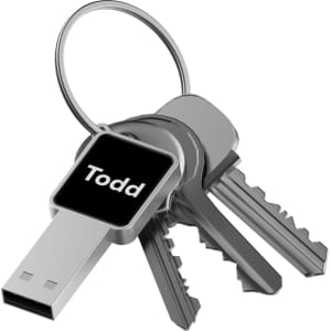 A metallic LED flash drive attached to a keyring, alongside three silver keys. The flash drive features a logo.