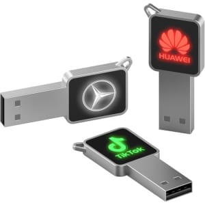 Three silver LED flash drives with various logos: a square drive, a rectangular drive, and a rounded drive.