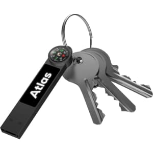 A black Atlas LED flash drive attached to a keyring alongside several keys, featuring a compass on the end.