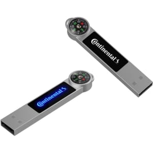 A silver Atlas LED flash drive featuring a compass on one end and a logo on the side.