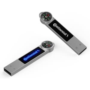 A silver LED flash drive featuring a compass on top and a logo, with blue and white backlighting.