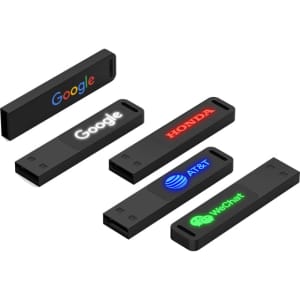 A collection of five black USB flash drives, each featuring different logos in various colours.