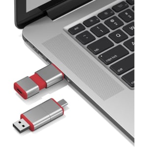 A silver and red Harris Type-C flash drive is plugged into a laptop USB port.
