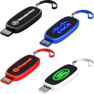 A collection of four LED flash drives in black, blue, red, and white, each featuring different logos.
