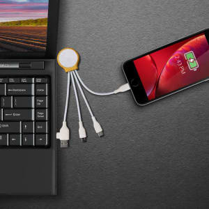 A charging cable in yellow and white connects a smartphone to a laptop, featuring multiple connectors.