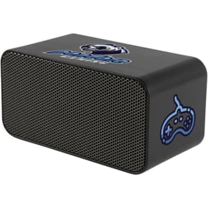A black wireless charging speaker with a mesh front and a logo on top, designed for phone compatibility.