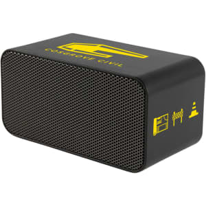 A black wireless charging speaker with a textured front, featuring a yellow logo and icons.