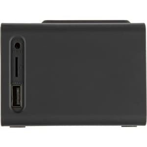 A black wireless charger speaker with ports for AUX, reset, and USB output on the side.