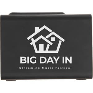 A black wireless charger with speaker features a house logo and promotional text for a music festival.