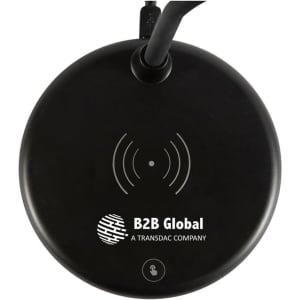 A circular black wireless charging sound lamp with a visible logo. The design is sleek and modern.
