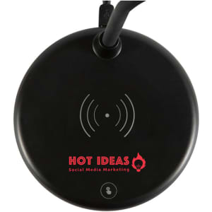 A circular black wireless charging lamp with a built-in light, featuring a logo and a charging indicator.