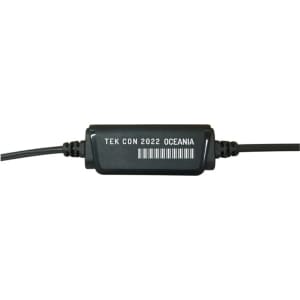 A black audio connector with wires, featuring a label with text and a barcode.