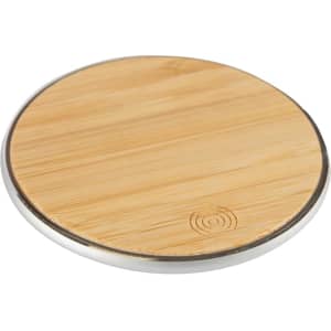 A round, bamboo wireless charger with a silver rim, featuring a smooth wooden surface.
