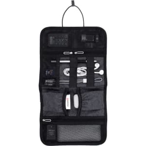 A black toiletry accessory roll featuring various compartments and pouches for organising small items.